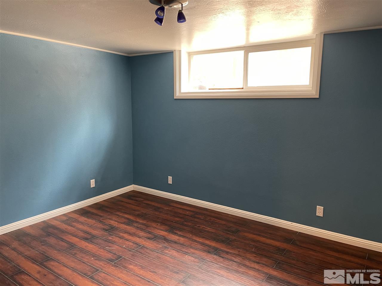 1690 Carlin Street Reno, NV 89503 - Photo 21 of 31 a view of empty room with wooden floor