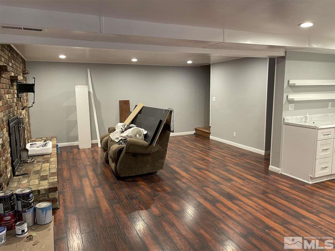 1690 Carlin Street Reno, NV 89503 - Photo 23 of 31 a living room with furniture and a wooden floor