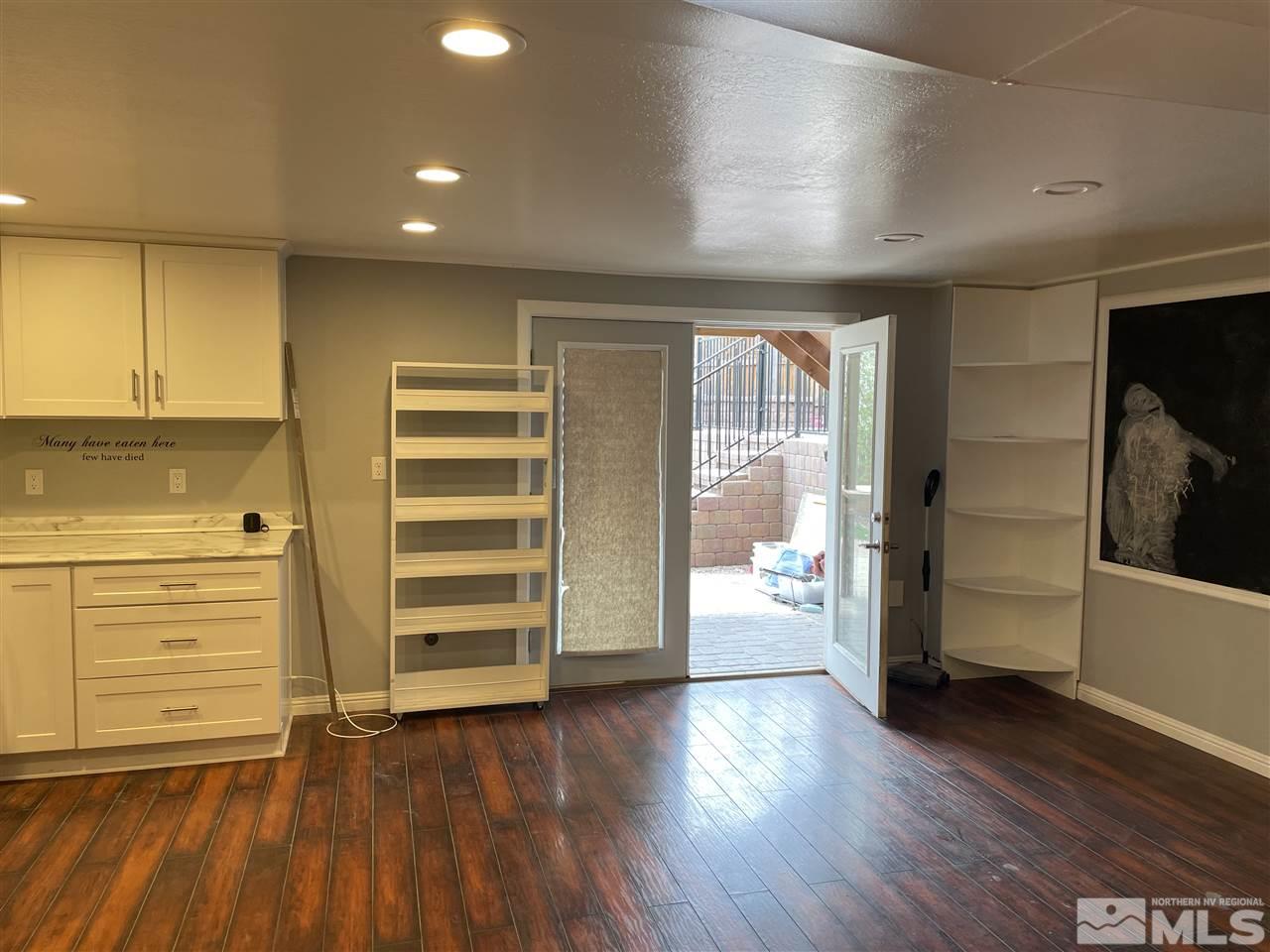 1690 Carlin Street Reno, NV 89503 - Photo 24 of 31 wooden floor in an empty room with a window