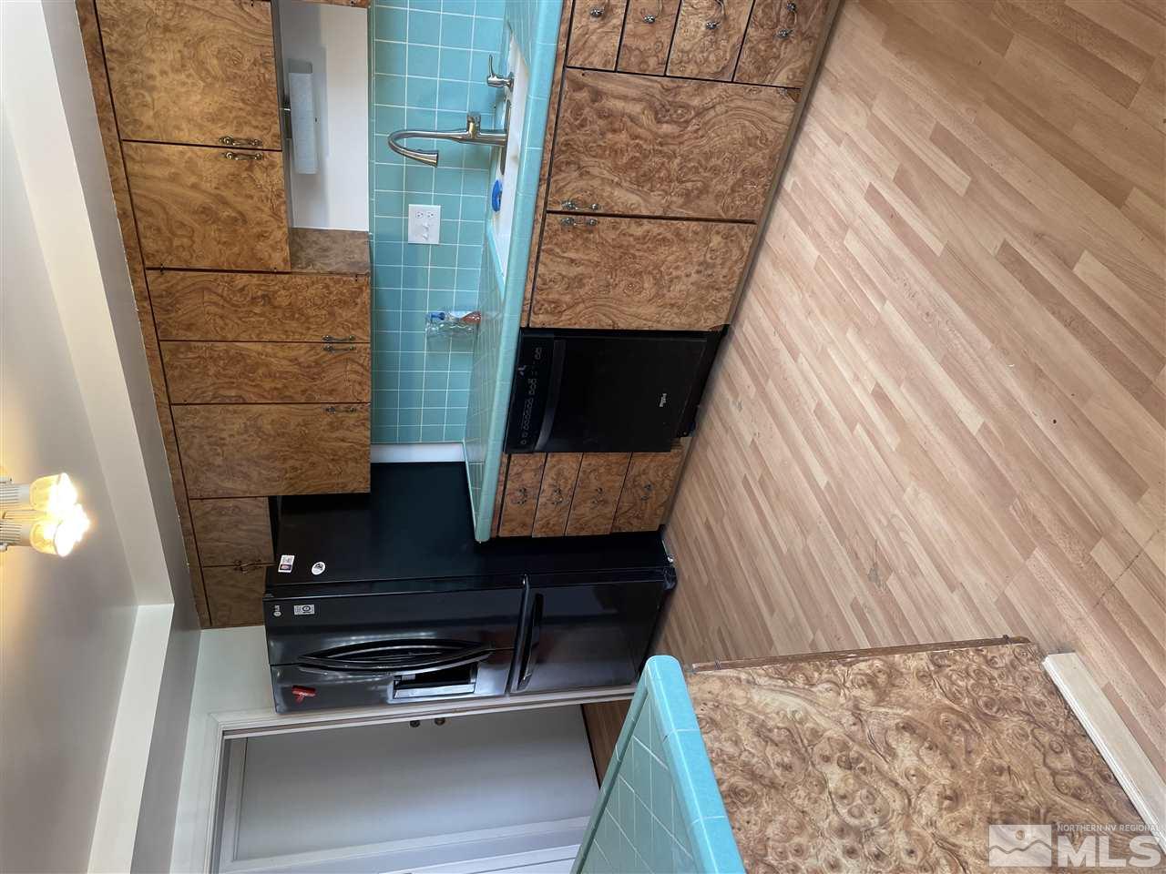 1690 Carlin Street Reno, NV 89503 - Photo 5 of 31 a kitchen with stainless steel appliances granite countertop a refrigerator and a sink