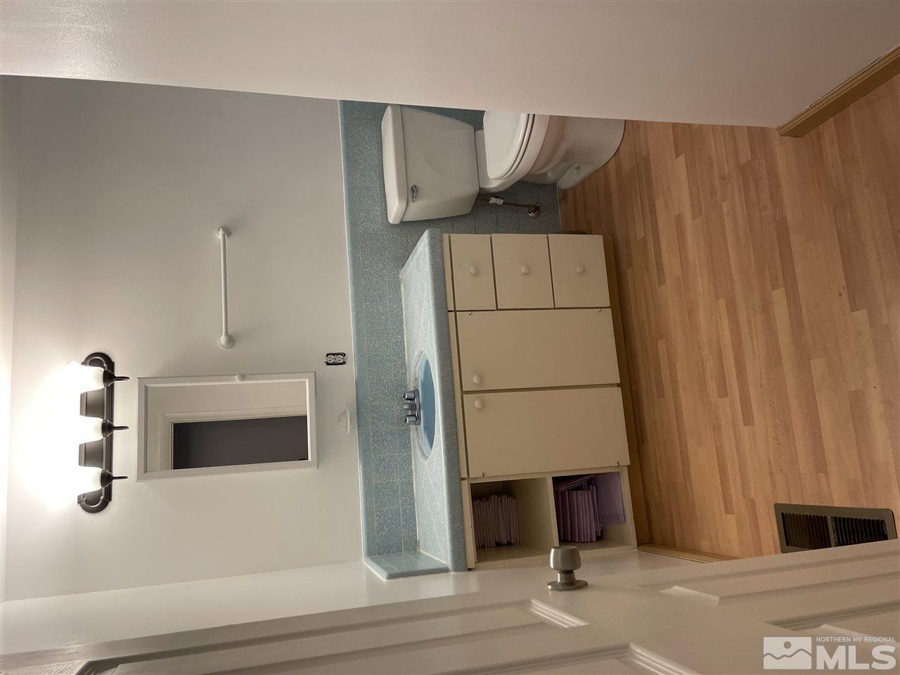 1690 Carlin Street Reno, NV 89503 - Photo 7 of 31 a bathroom with a sink and a toilet