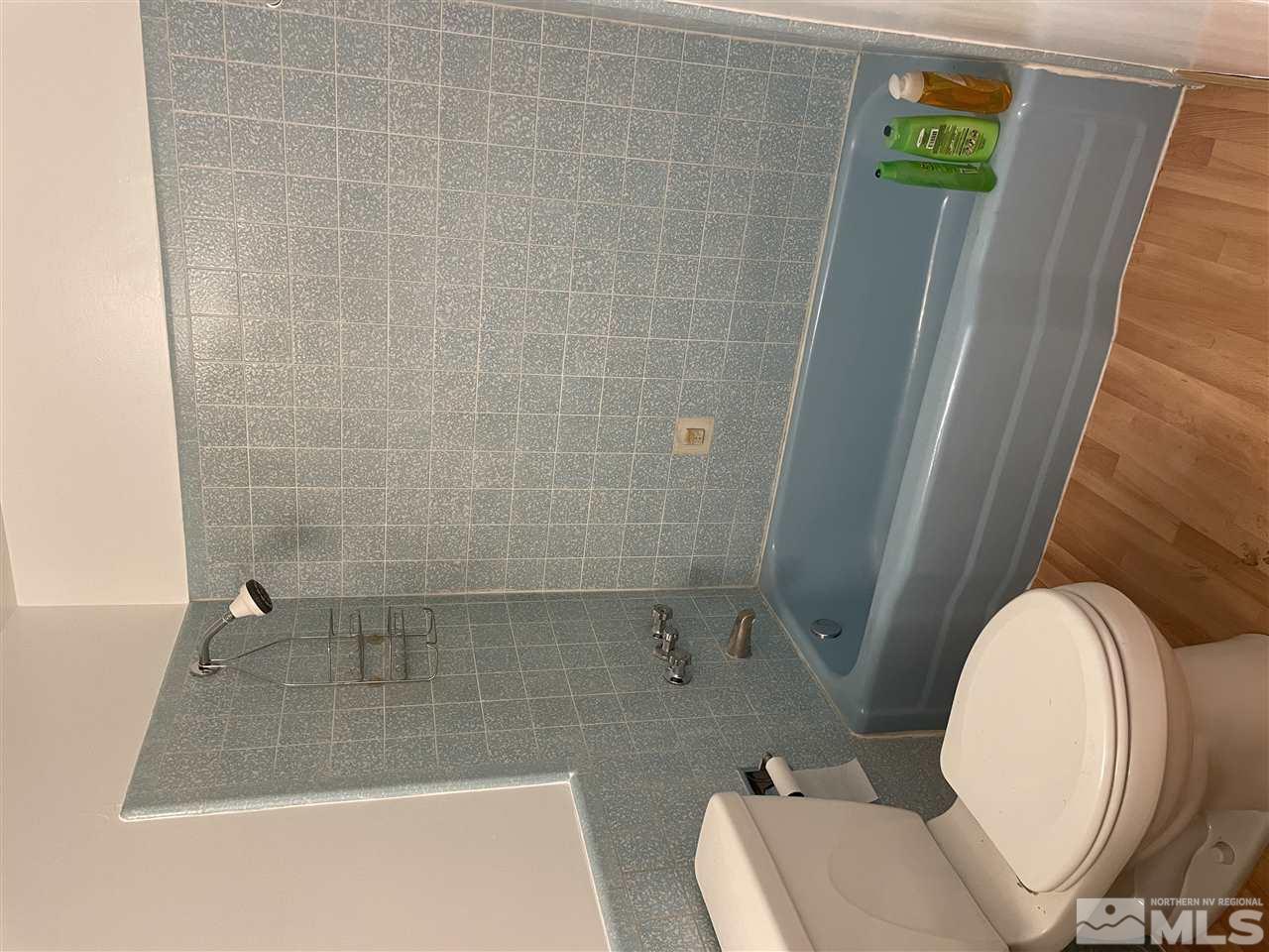 1690 Carlin Street Reno, NV 89503 - Photo 8 of 31 a bathroom with a toilet and a shower
