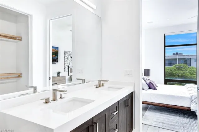 a en suite bathroom with a sink and a mirror