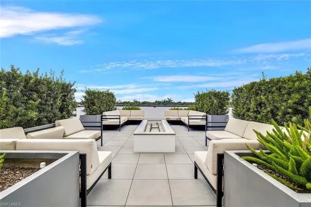 a terrace view with sitting space and garden