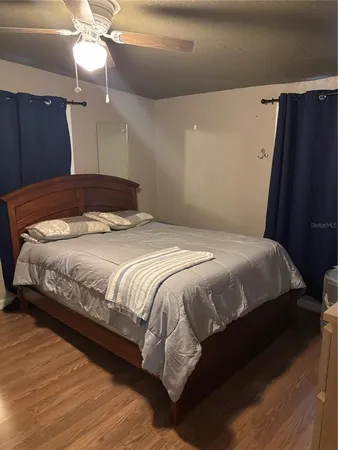 a bedroom with a bed and a walk in closet