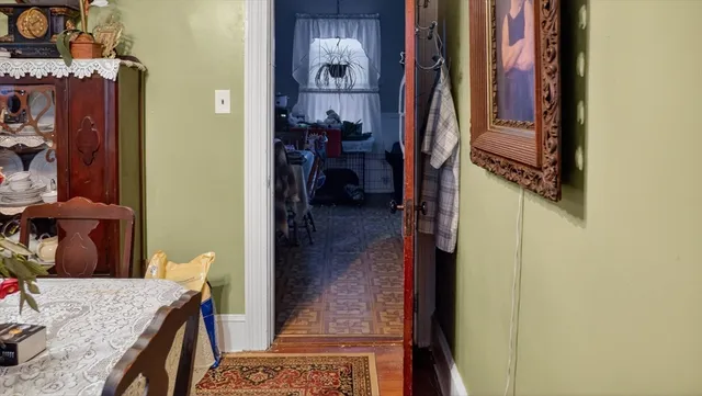 a view of walk in closet and bedroom