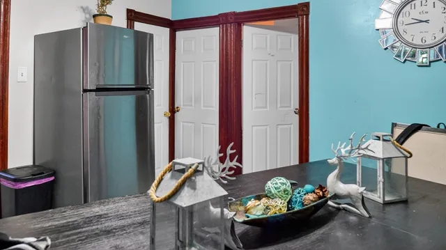 a view of a livingroom with furniture and a table