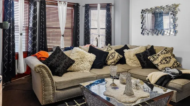 a living room with furniture and a window