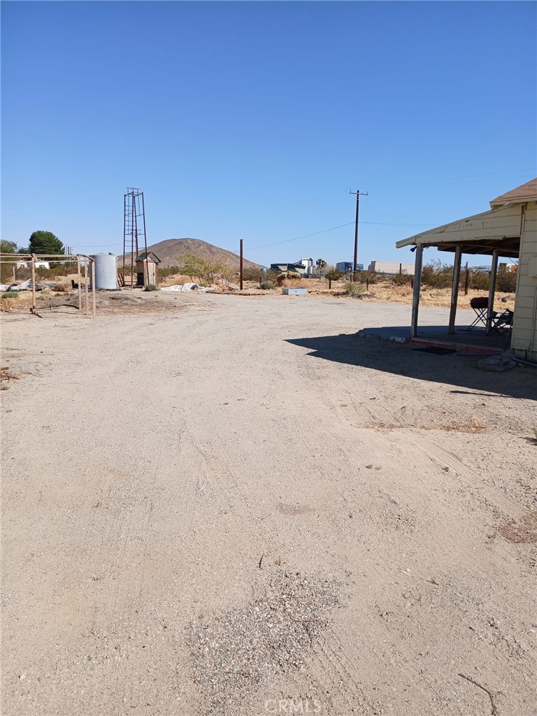 37712 210th Street East Palmdale, CA 93591 - Photo 11 of 12 a view of a terrace with trees