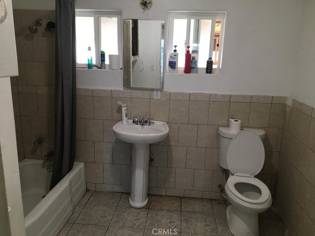 37712 210th Street East Palmdale, CA 93591 - Photo 8 of 12 a bathroom with a sink toilet and shower