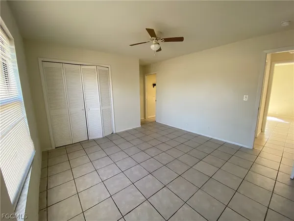 a view of an empty room and window