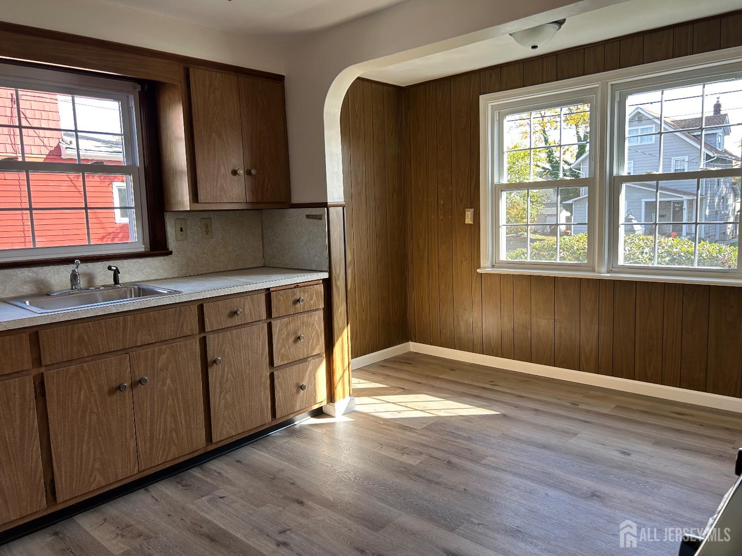 518 2nd Street Dunellen, NJ 08812 - Photo 4 of 14 a view of a kitchen with wooden floor and a window