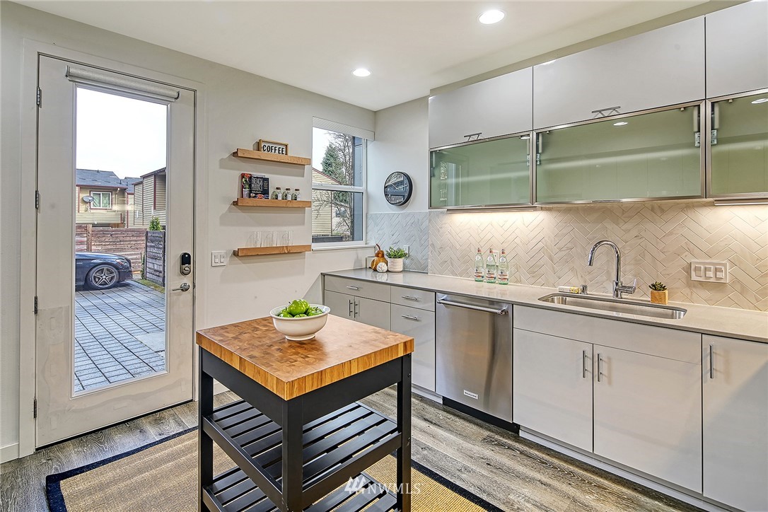 2858 Southwest Adams Street Seattle, WA 98126 - Photo 12 of 24 a kitchen with a sink cabinets and window