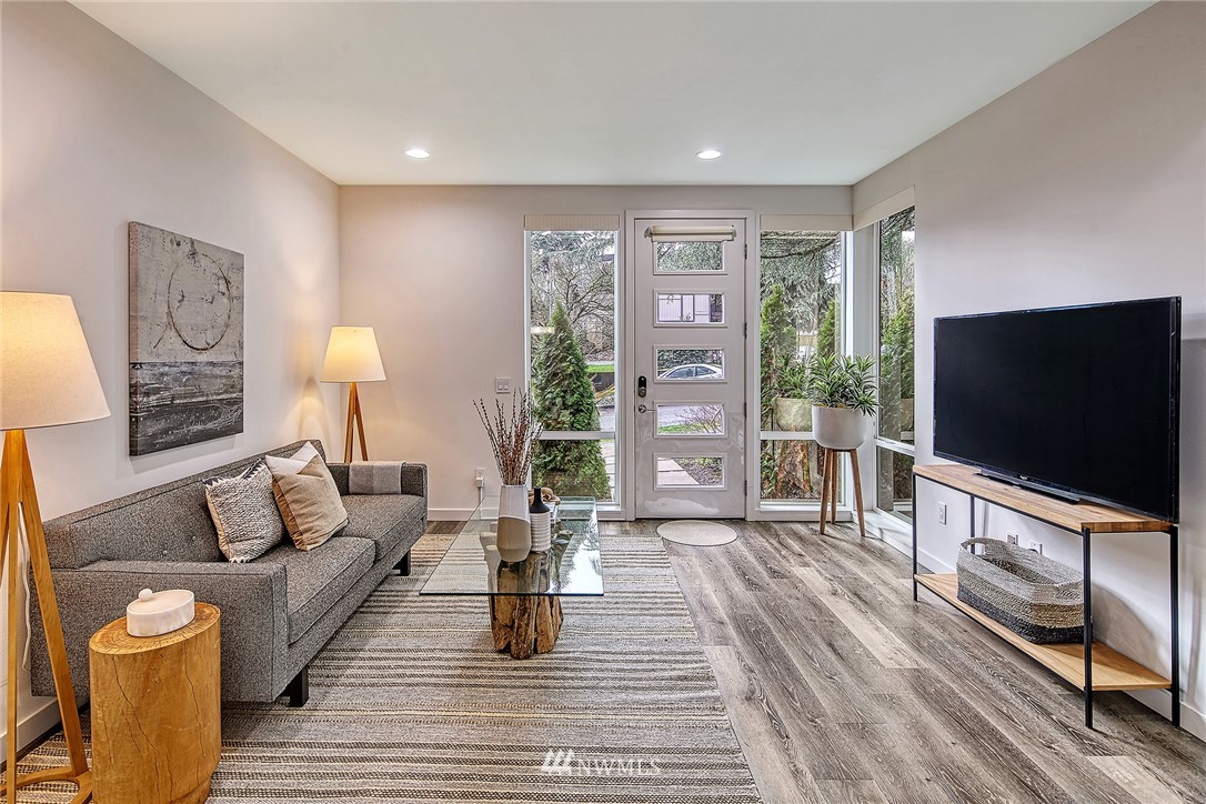 2858 Southwest Adams Street Seattle, WA 98126 - Photo 4 of 24 a living room with furniture and a flat screen tv