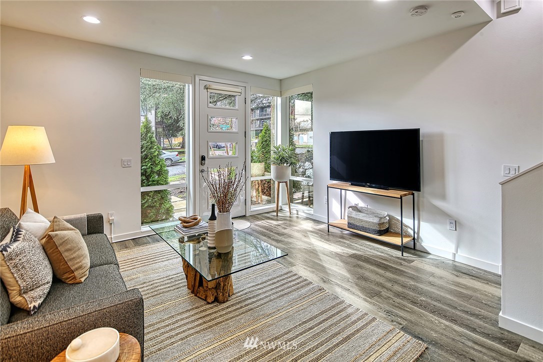 2858 Southwest Adams Street Seattle, WA 98126 - Photo 5 of 24 a living room with furniture and a flat screen tv