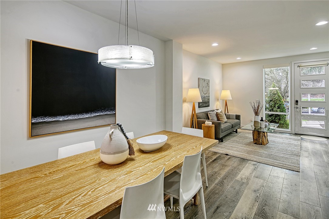 2858 Southwest Adams Street Seattle, WA 98126 - Photo 6 of 24 a view of a dining room with furniture and wooden floor