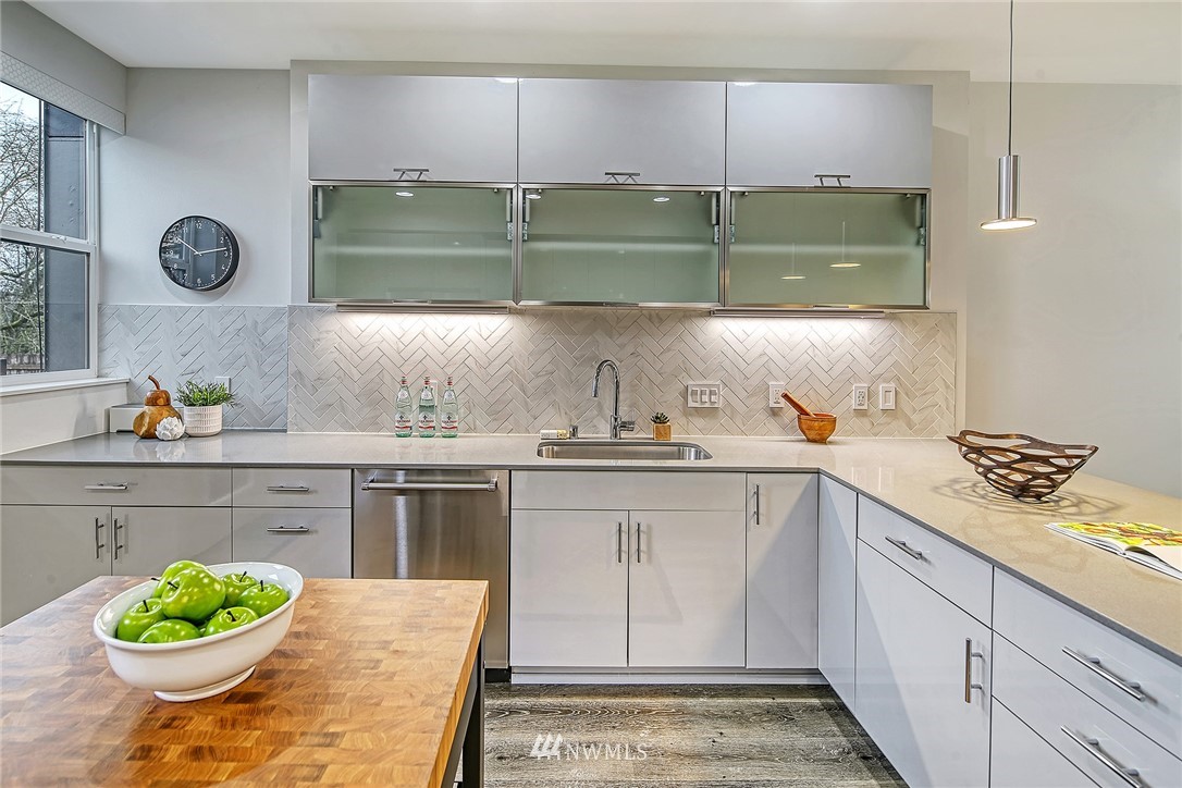 2858 Southwest Adams Street Seattle, WA 98126 - Photo 9 of 24 a kitchen with a stove and cabinets