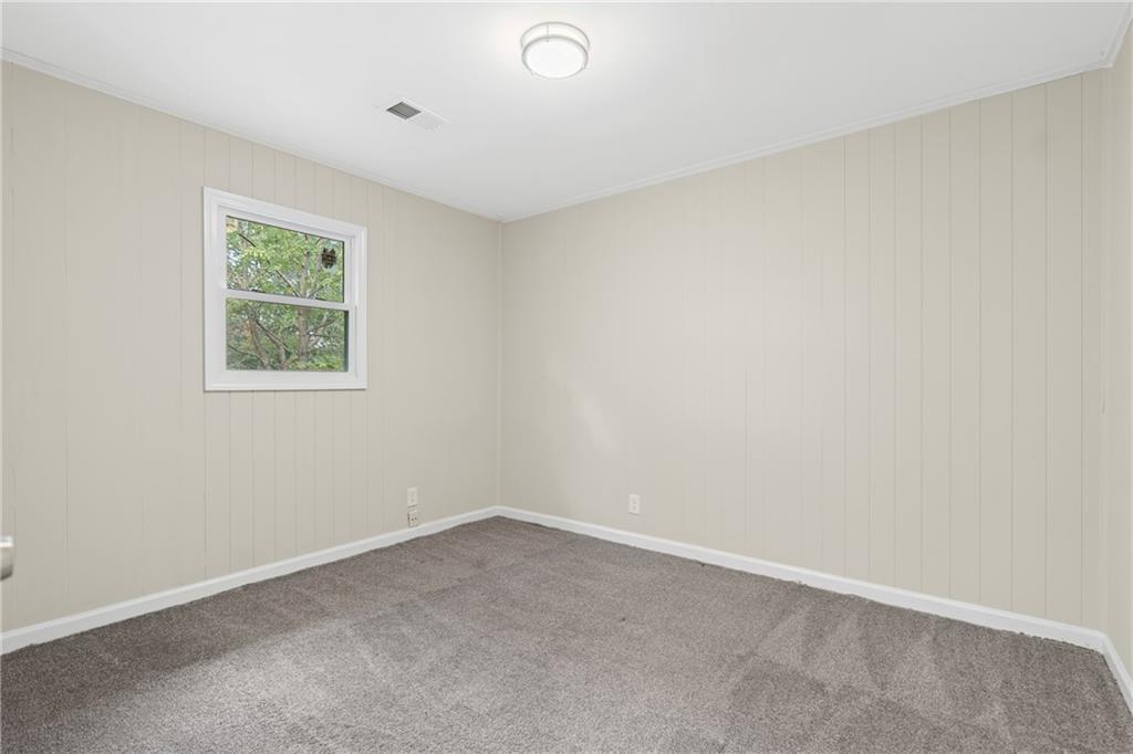 33 Smyrna Powder Springs Road Southeast Marietta, GA 30060 - Photo 17 of 37 an empty room with a window