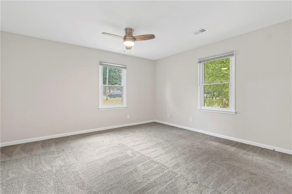 33 Smyrna Powder Springs Road Southeast Marietta, GA 30060 - Photo 20 of 37 a view of an empty room with a window
