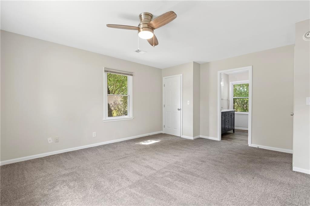 33 Smyrna Powder Springs Road Southeast Marietta, GA 30060 - Photo 21 of 37 wooden floor in an empty room with a window