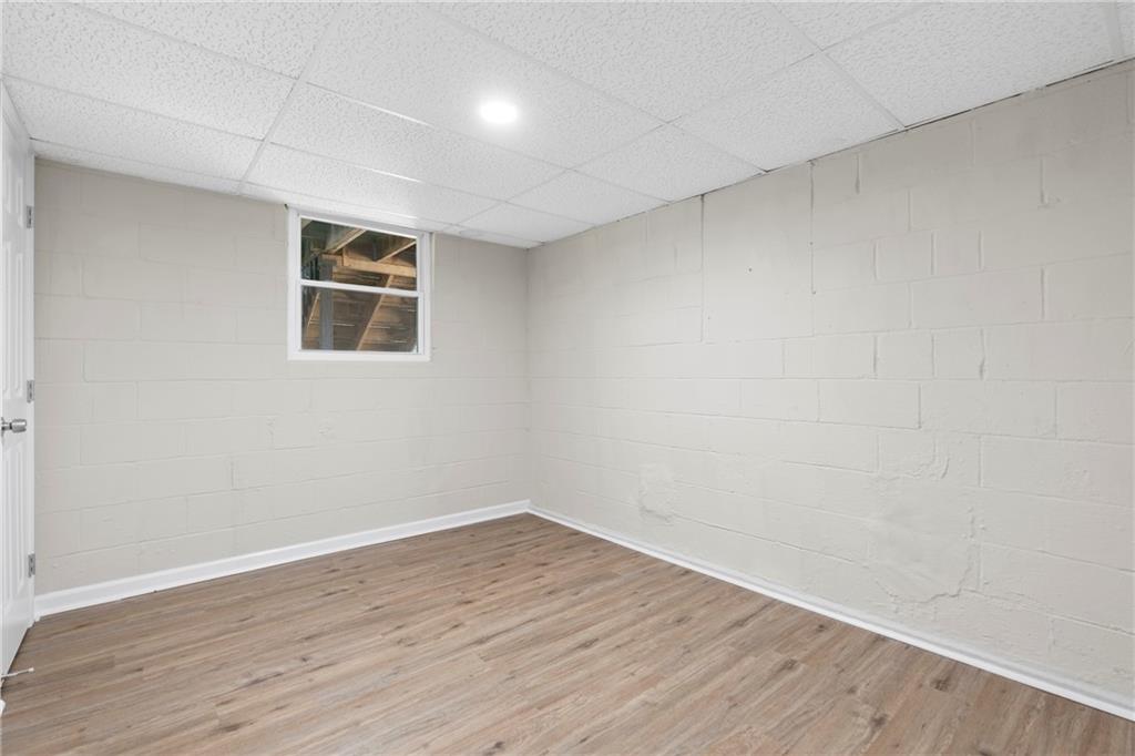 33 Smyrna Powder Springs Road Southeast Marietta, GA 30060 - Photo 24 of 37 a view of a room with wooden floor and white walls