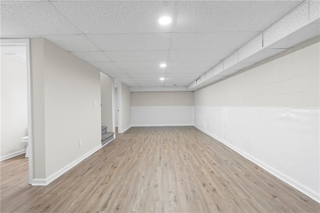 33 Smyrna Powder Springs Road Southeast Marietta, GA 30060 - Photo 26 of 37 a view of a room with wooden floors and led lights