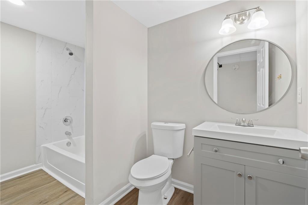 33 Smyrna Powder Springs Road Southeast Marietta, GA 30060 - Photo 27 of 37 a bathroom with a toilet sink and mirror