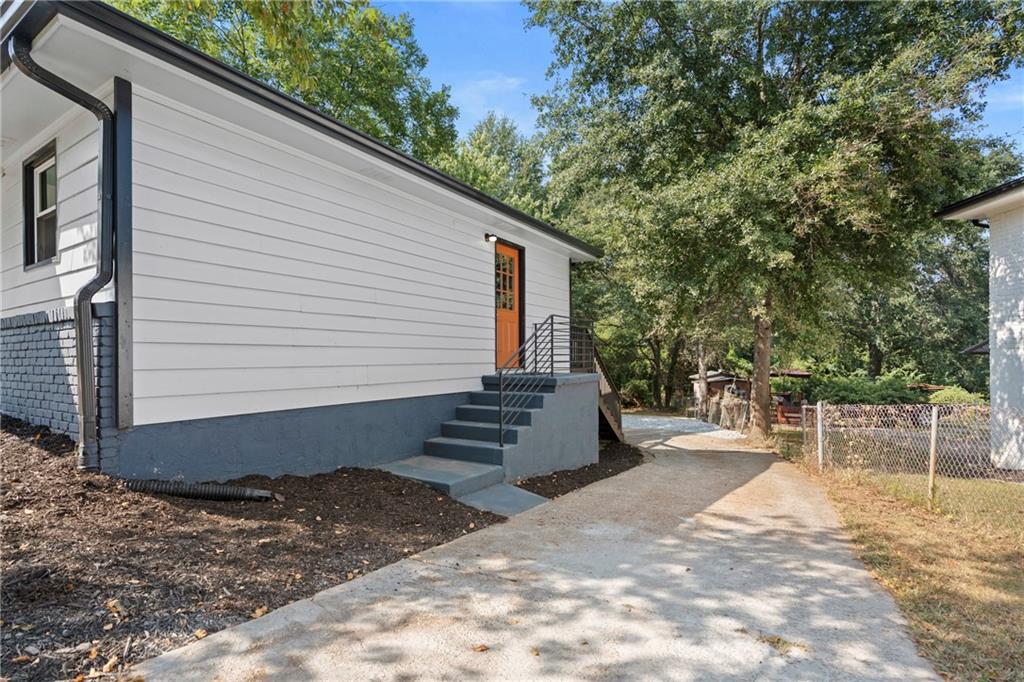 33 Smyrna Powder Springs Road Southeast Marietta, GA 30060 - Photo 3 of 37 a view of a backyard with a tree