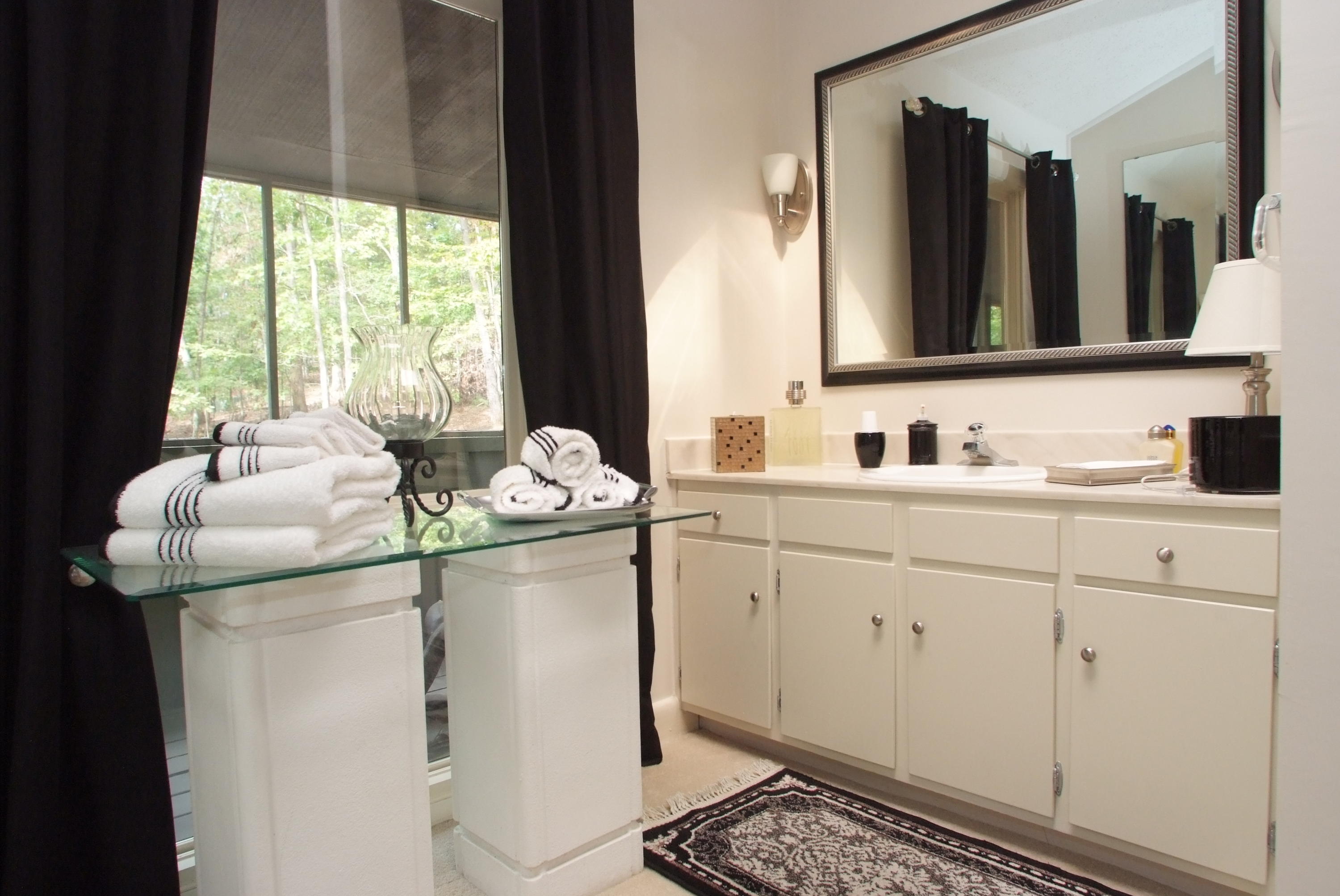 4838 Deerfield Road Southwest Roanoke, VA 24018 - Photo 20 of 26 a bathroom with a sink and a mirror