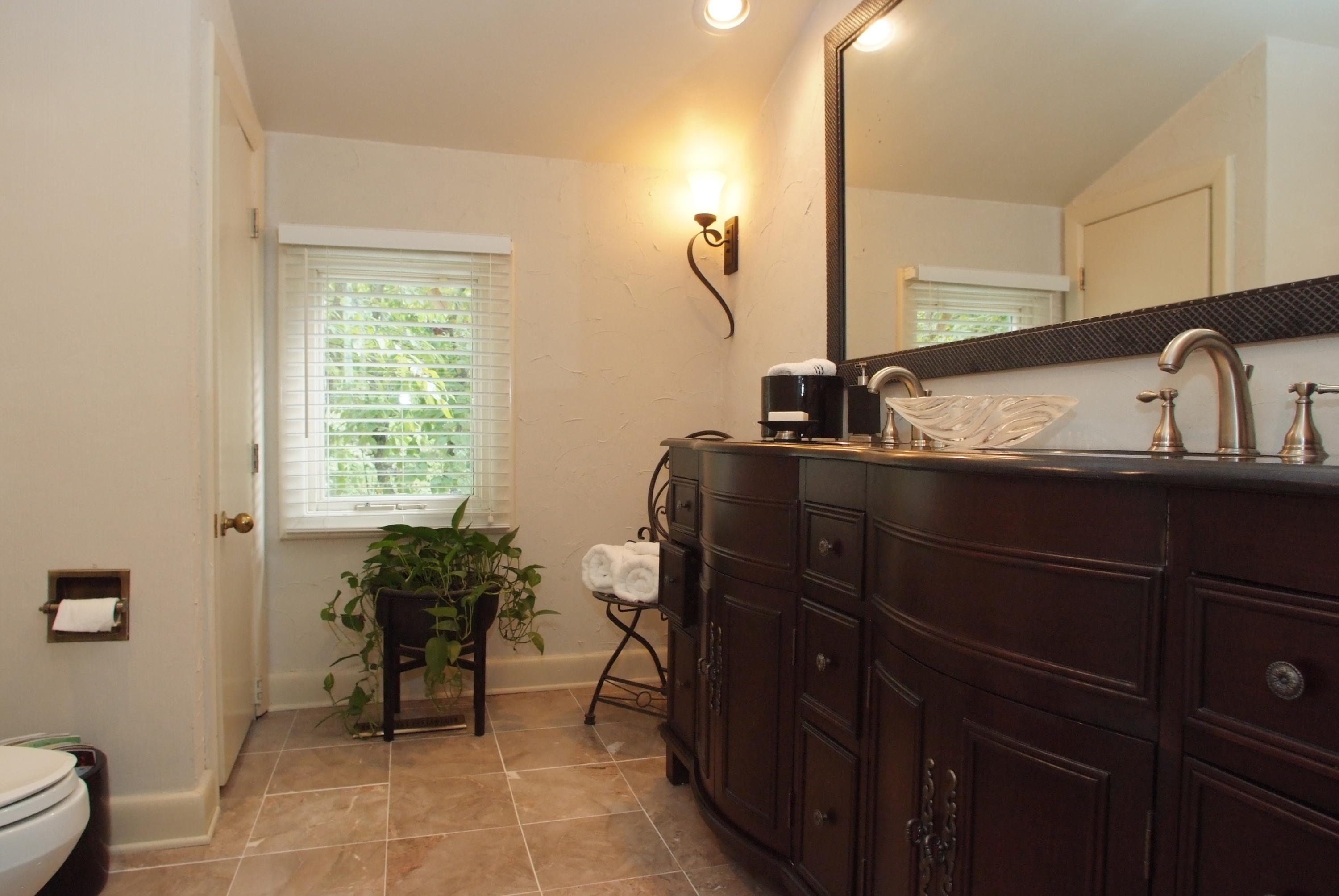 4838 Deerfield Road Southwest Roanoke, VA 24018 - Photo 23 of 26 a bathroom with a sink and a mirror