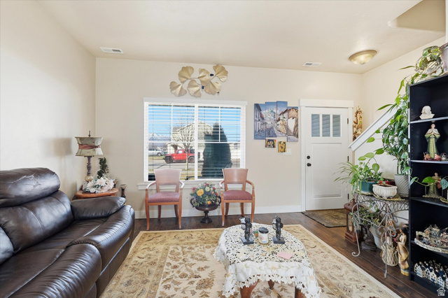 1084 South 740 East Logan, UT 84321 - Photo 2 of 23 Living area with dark wood finished floors and baseboards