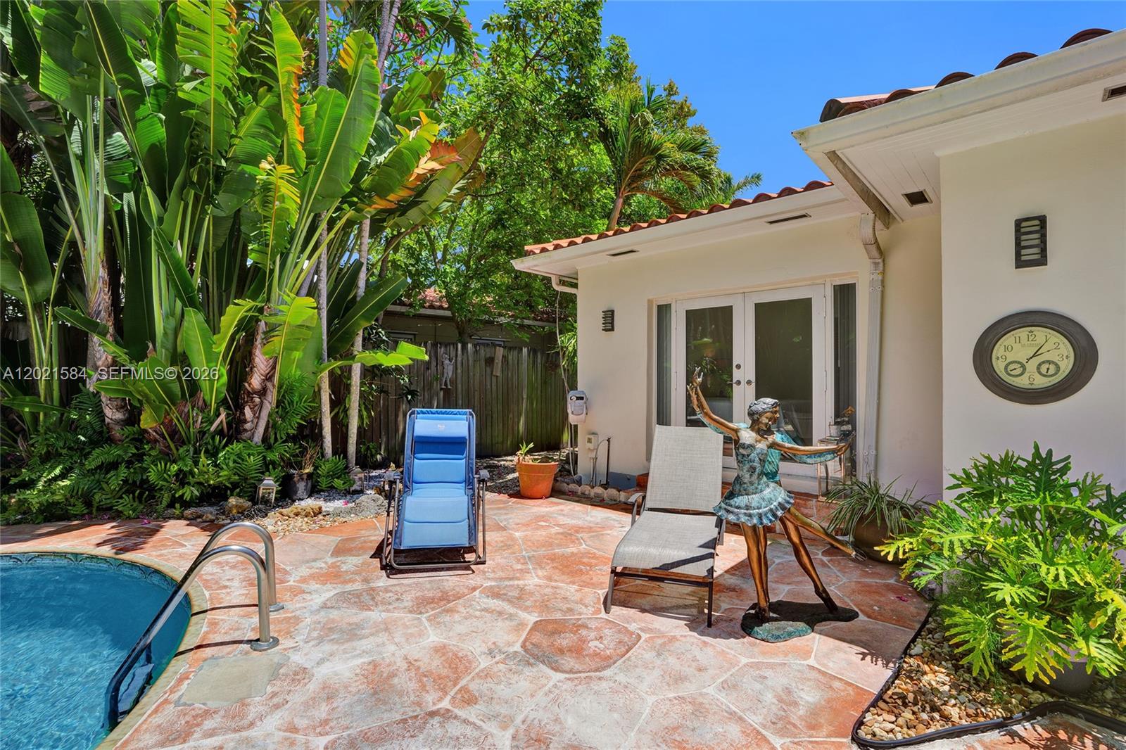 811 Northeast 73rd Street Miami, FL 33138 - Photo 27 of 51 a view of a backyard with sitting area and garden