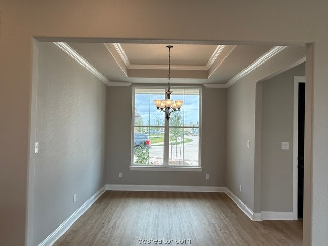 6428 Raleigh Loop College Station, TX 77845 - Photo 9 of 20 an empty room with wooden floor and windows
