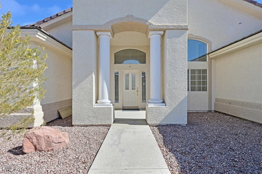 6120 Farm Road Las Vegas, NV 89131 - Photo 2 of 30 Entrance to property with stucco siding