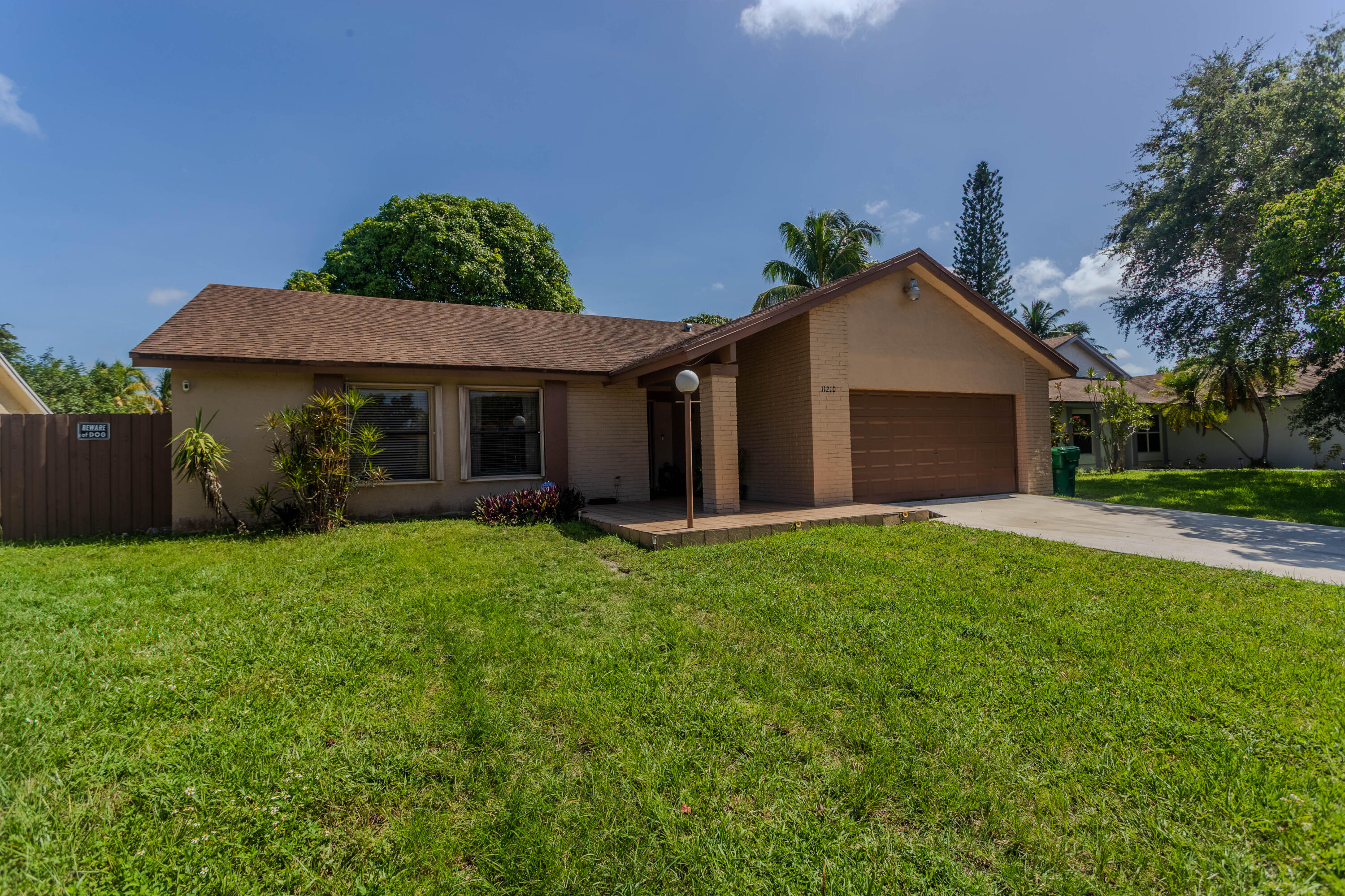 11210 Southwest 157th Street Miami, FL 33157 - Photo 2 of 55 a view of a house with a yard