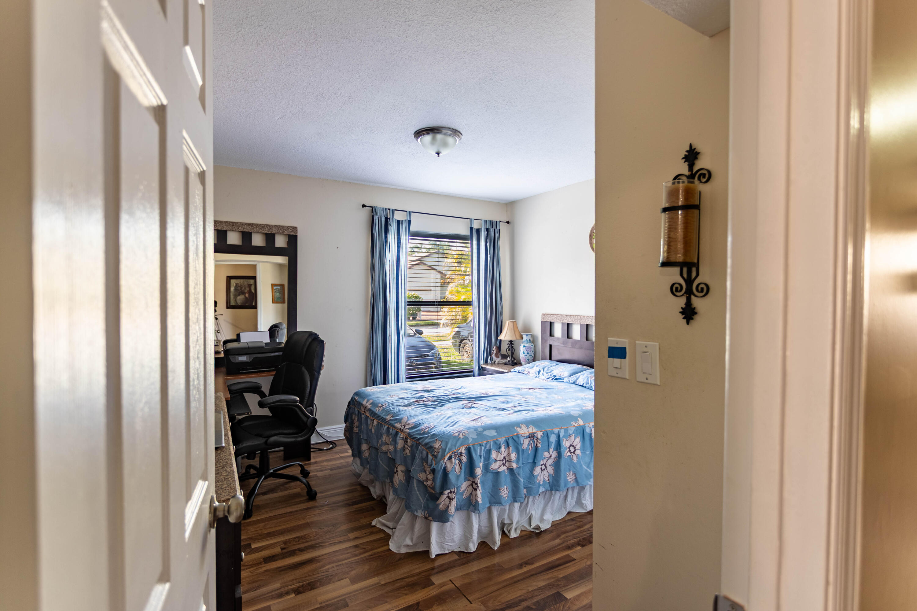 11210 Southwest 157th Street Miami, FL 33157 - Photo 21 of 55 a bedroom with a bed and wooden floor