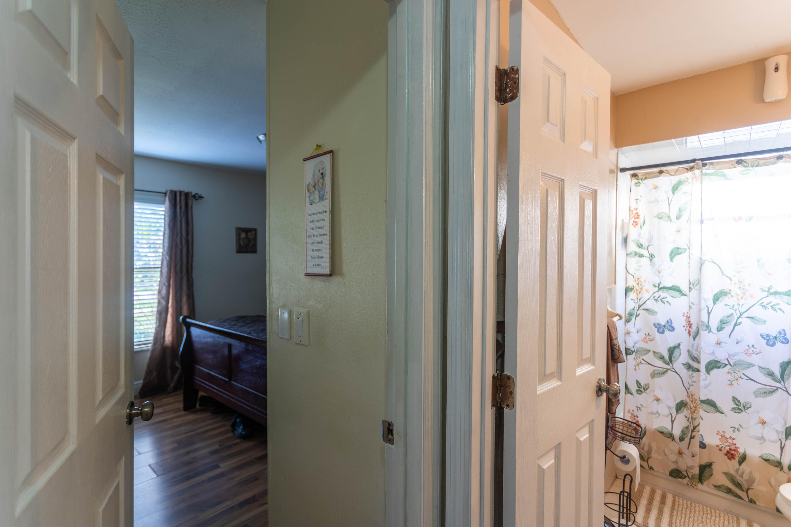 11210 Southwest 157th Street Miami, FL 33157 - Photo 23 of 55 a view of a hallway with wooden floor and closet with mirror