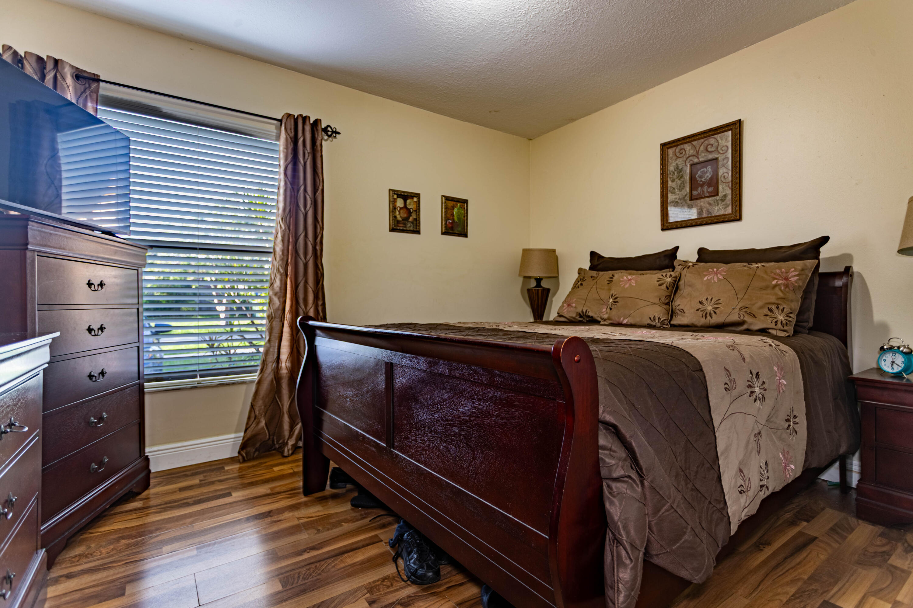 11210 Southwest 157th Street Miami, FL 33157 - Photo 28 of 55 a bedroom with a bed and a dresser