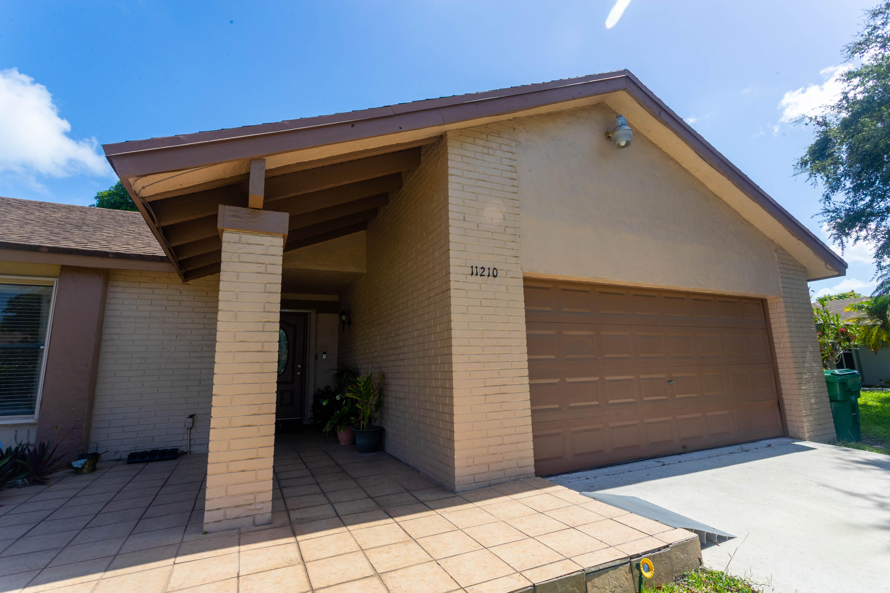 11210 Southwest 157th Street Miami, FL 33157 - Photo 3 of 55 a front view of a house