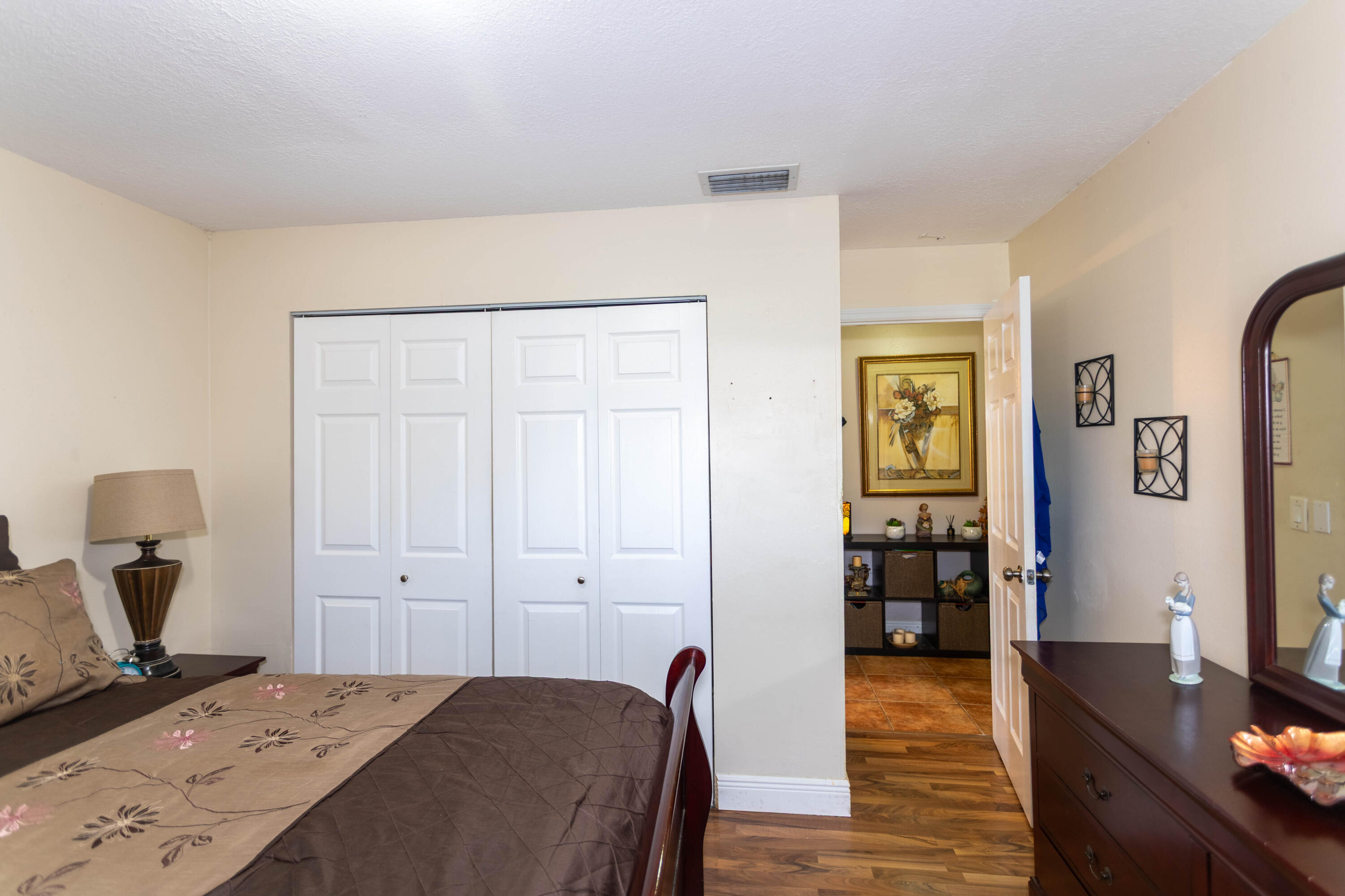 11210 Southwest 157th Street Miami, FL 33157 - Photo 31 of 55 a bedroom with a bed and wooden floor