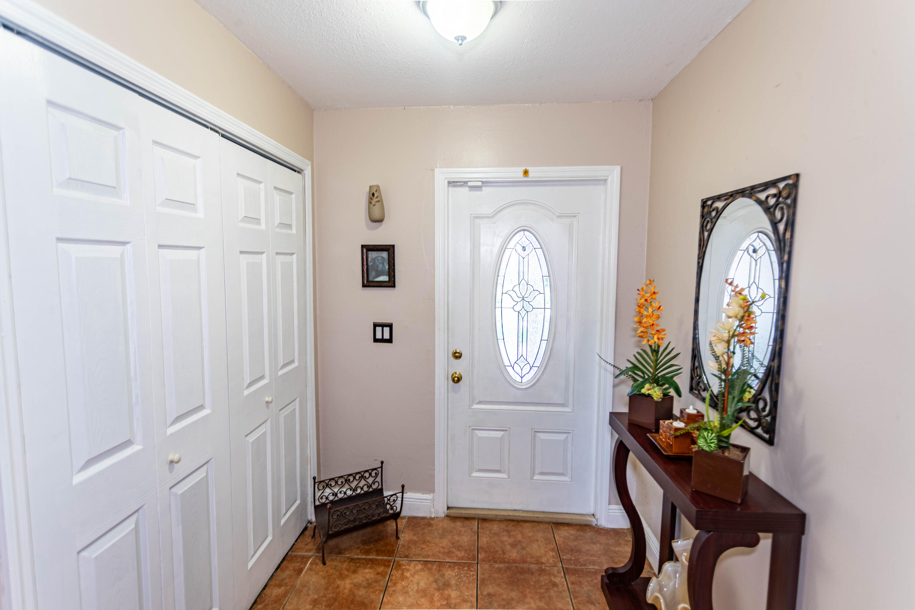 11210 Southwest 157th Street Miami, FL 33157 - Photo 33 of 55 a living room with furniture and a potted plant