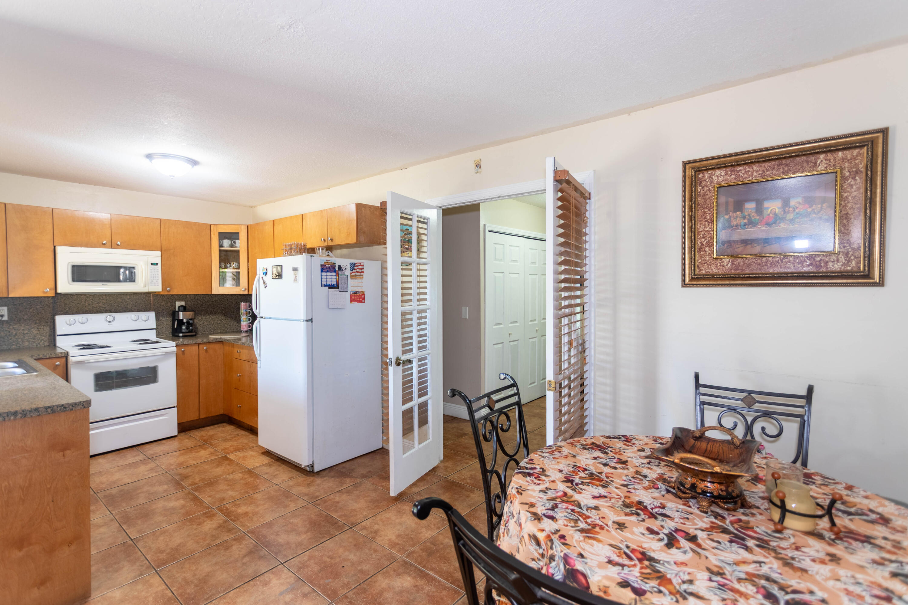 11210 Southwest 157th Street Miami, FL 33157 - Photo 35 of 55 a bedroom with furniture and a refrigerator