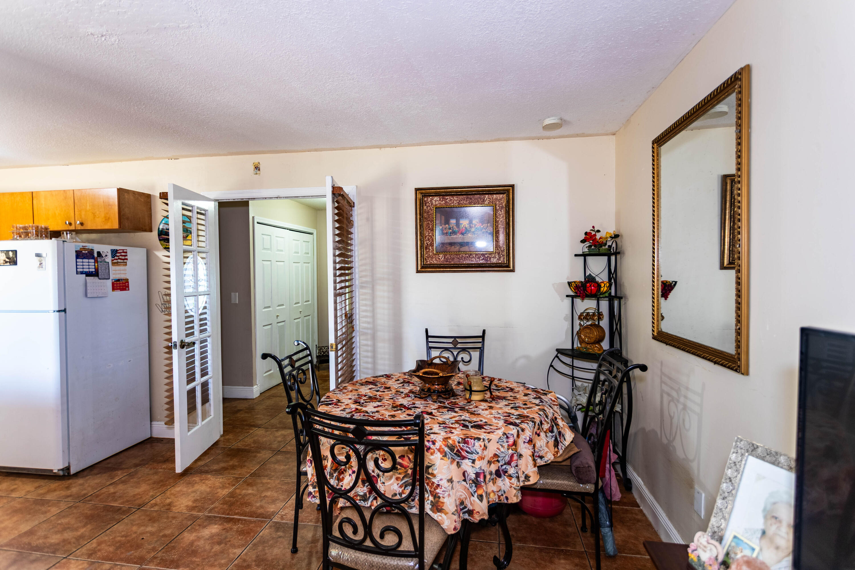 11210 Southwest 157th Street Miami, FL 33157 - Photo 36 of 55 a bedroom with a bed and a table in it