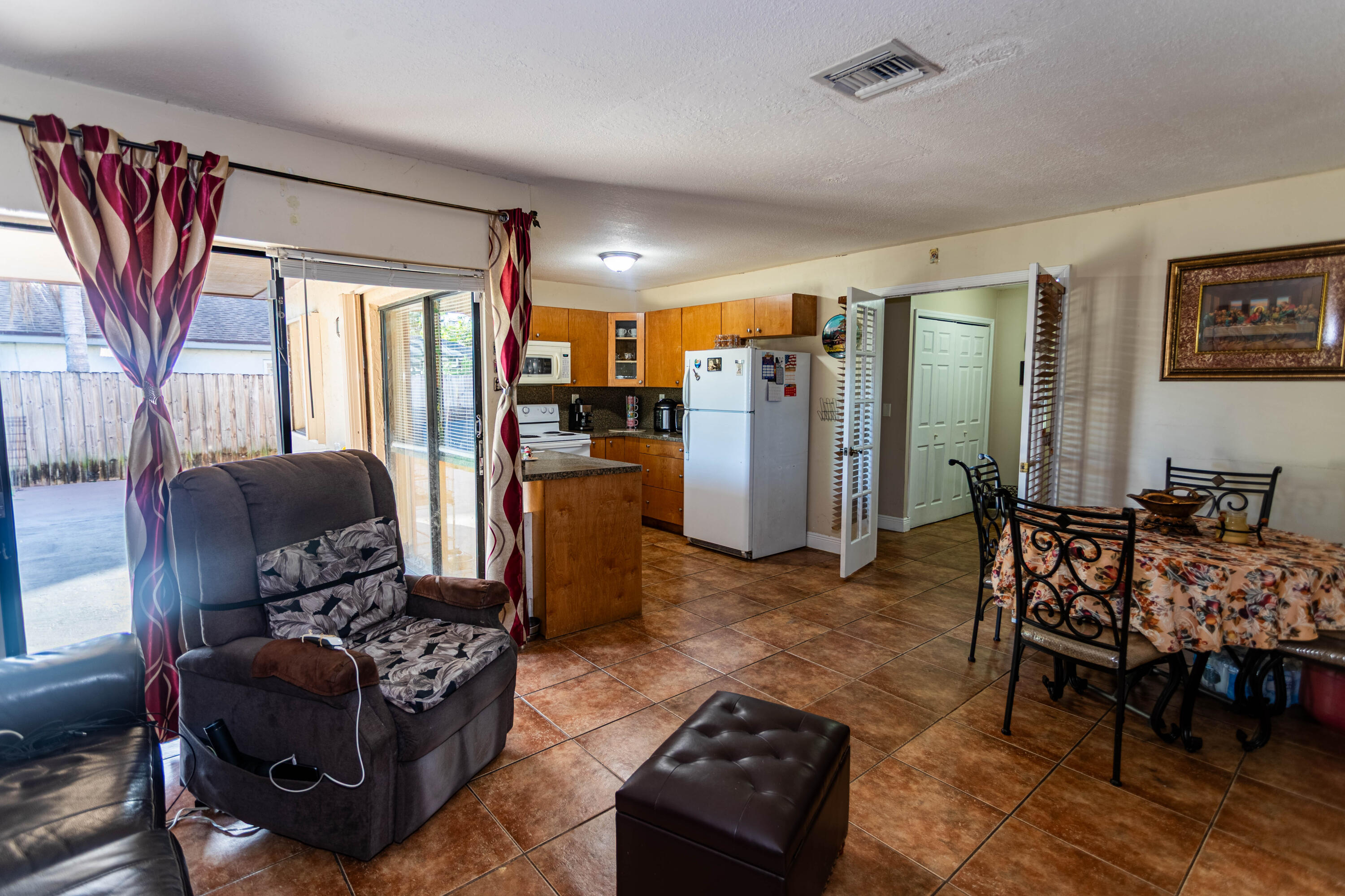 11210 Southwest 157th Street Miami, FL 33157 - Photo 38 of 55 a living room with furniture and a window