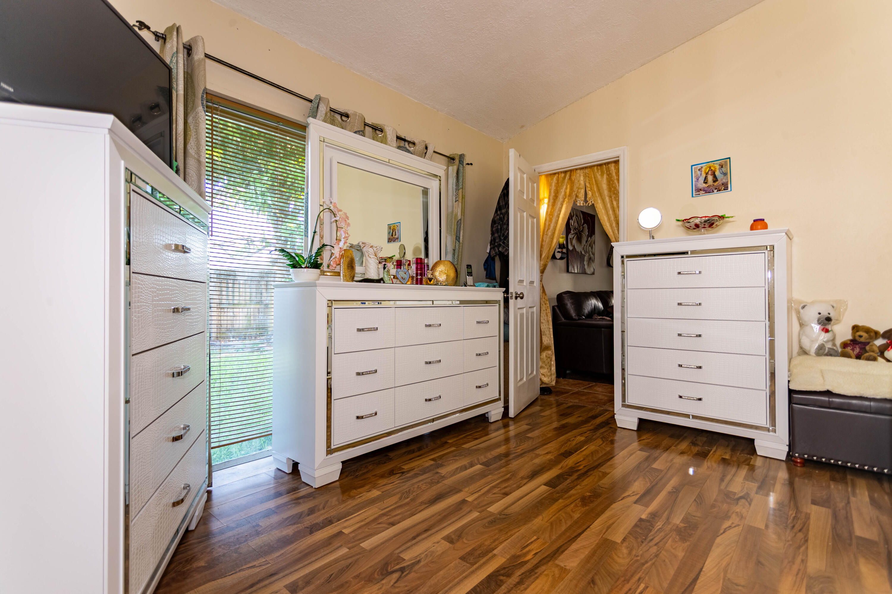 11210 Southwest 157th Street Miami, FL 33157 - Photo 48 of 55 a view of a dresser with wooden floor