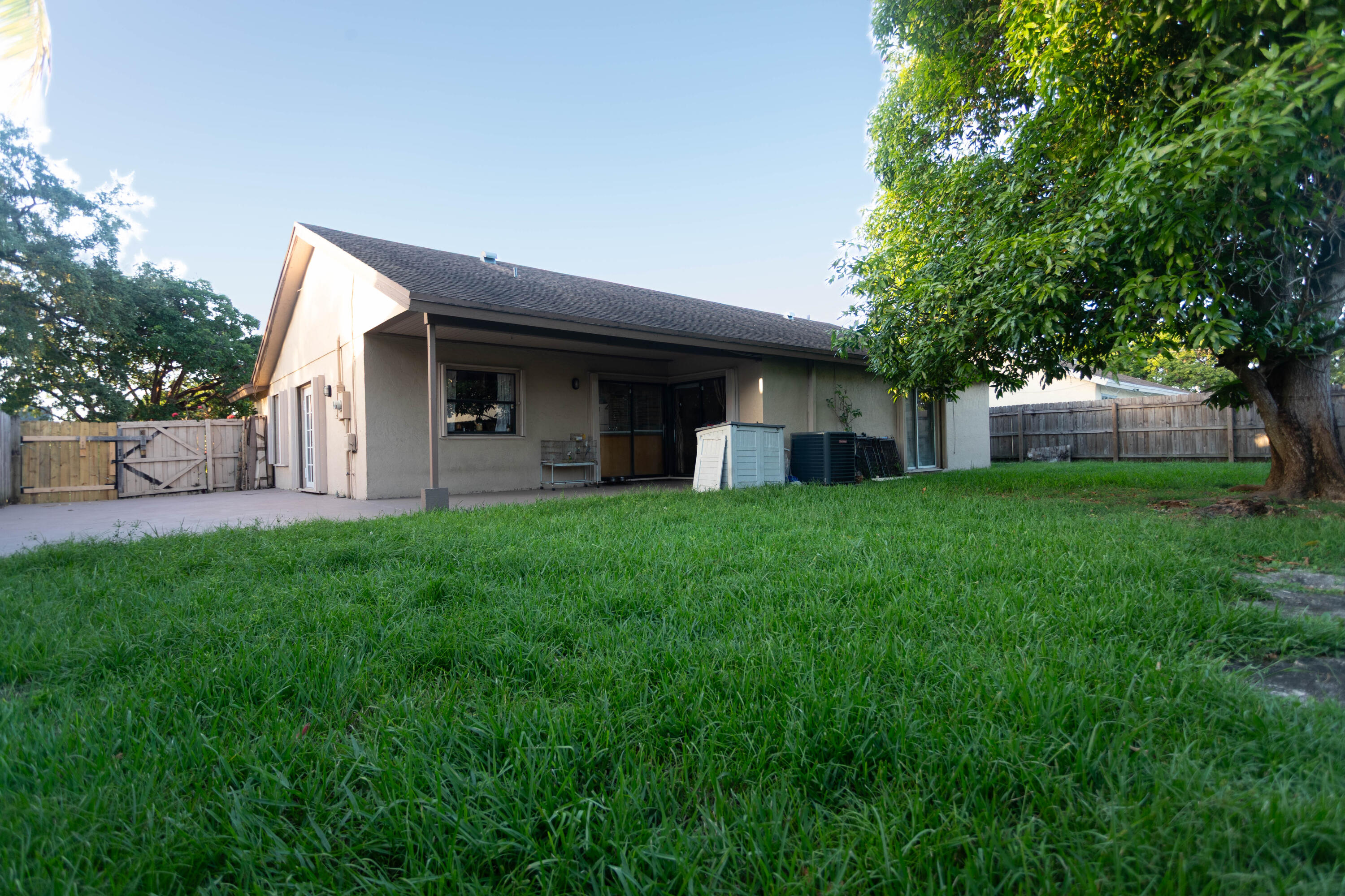 11210 Southwest 157th Street Miami, FL 33157 - Photo 52 of 55 a house view with a garden space