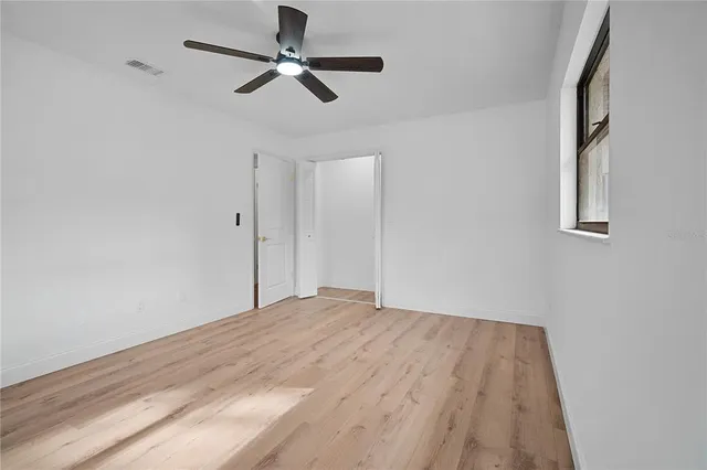 a view of wooden house and a yard