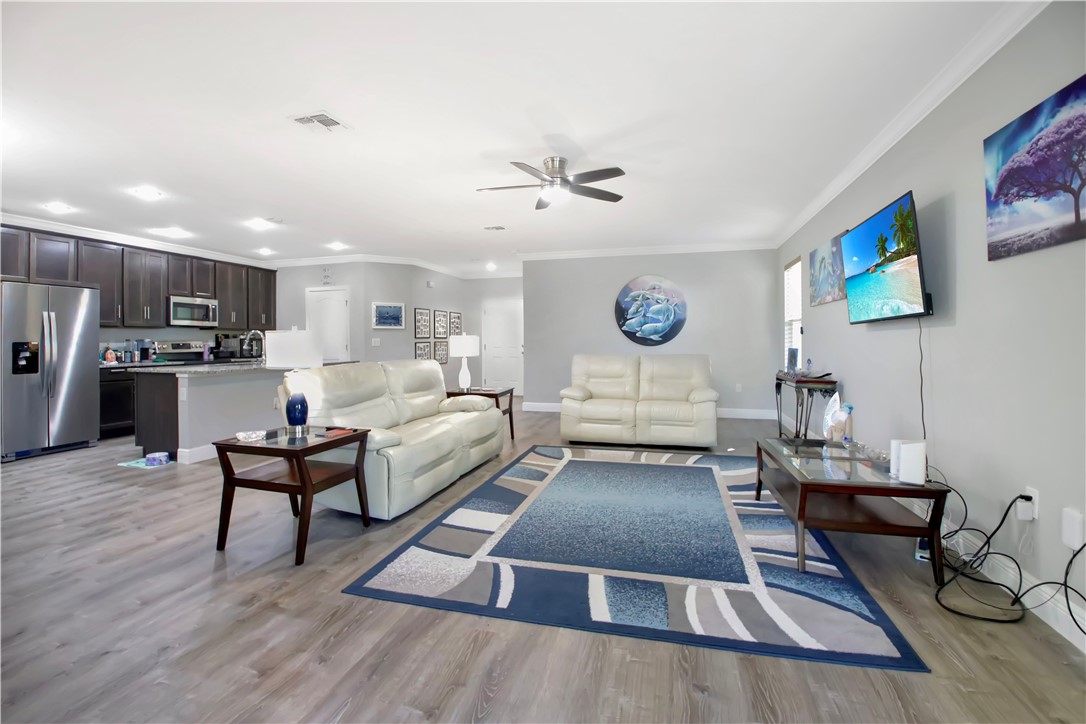 852 Jordan Avenue Sebastian, FL 32958 - Photo 4 of 36 a living room with furniture and kitchen view