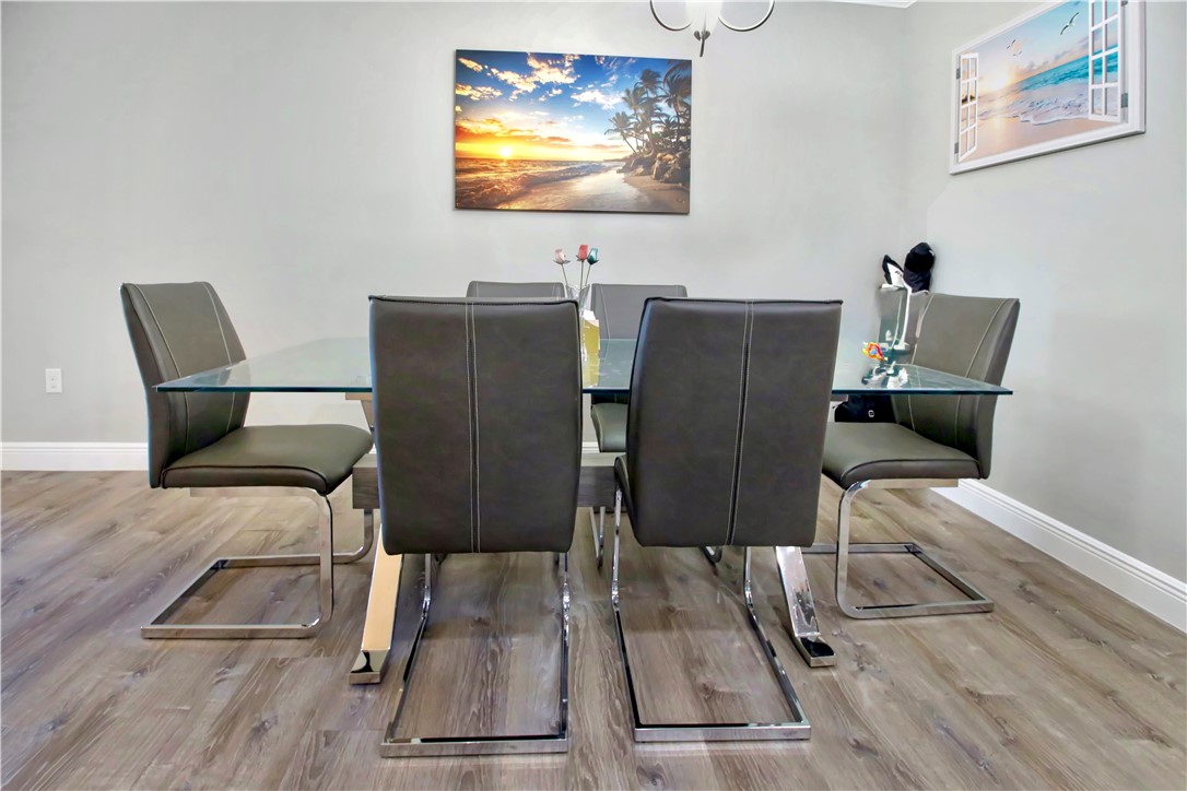 852 Jordan Avenue Sebastian, FL 32958 - Photo 9 of 36 a view of a dining room with furniture wooden floor and chandelier