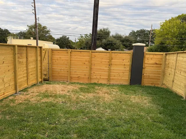 a view of a field with ocean view